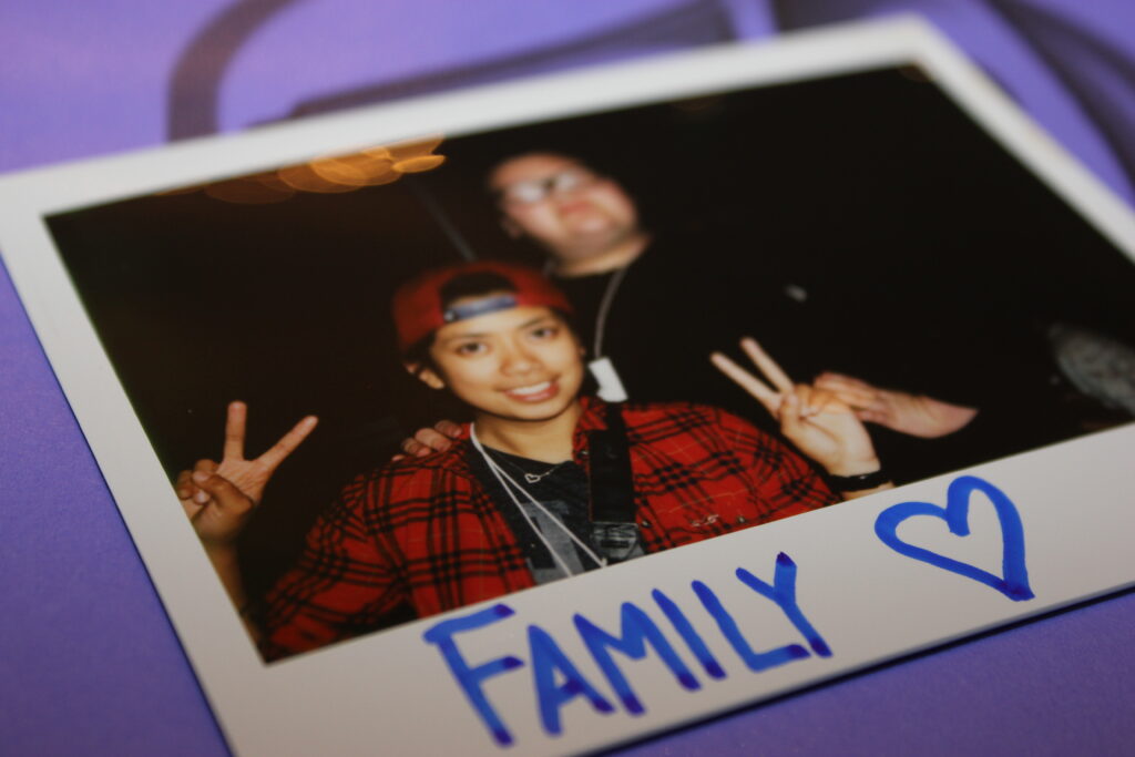 family moment peace sign party photo