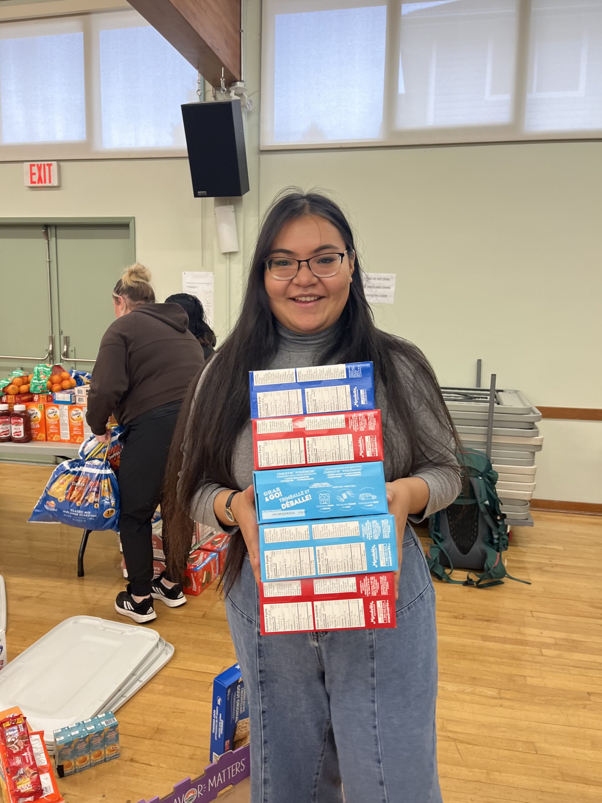 community food drive volunteers smiling scaled