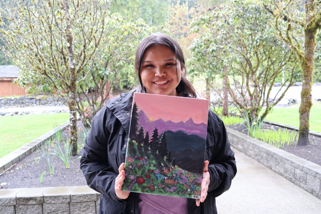artist with painting outdoor scene