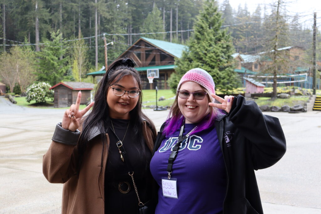 outdoor friends smiling peace sign nature scene