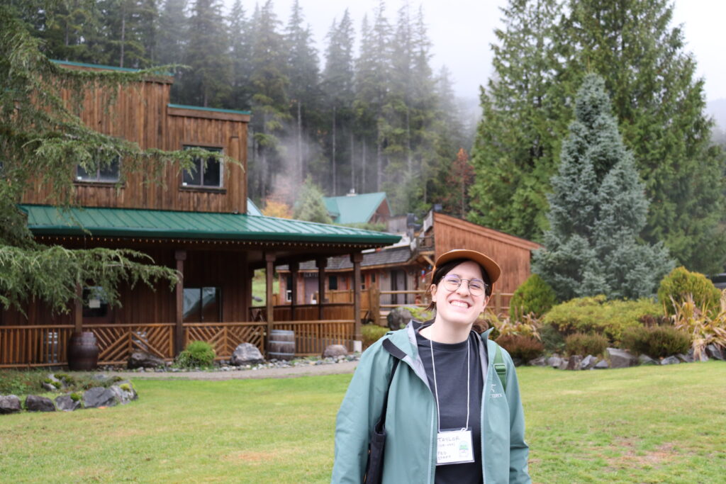 rustic lodge in forest misty scene joyful woman